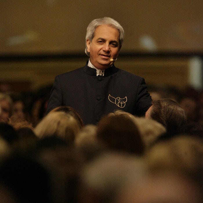 Pastor Benny Hinn teaching at a conference