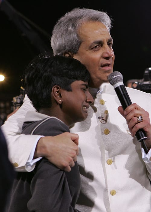 Pastor Benny Hinn prays for boy in India