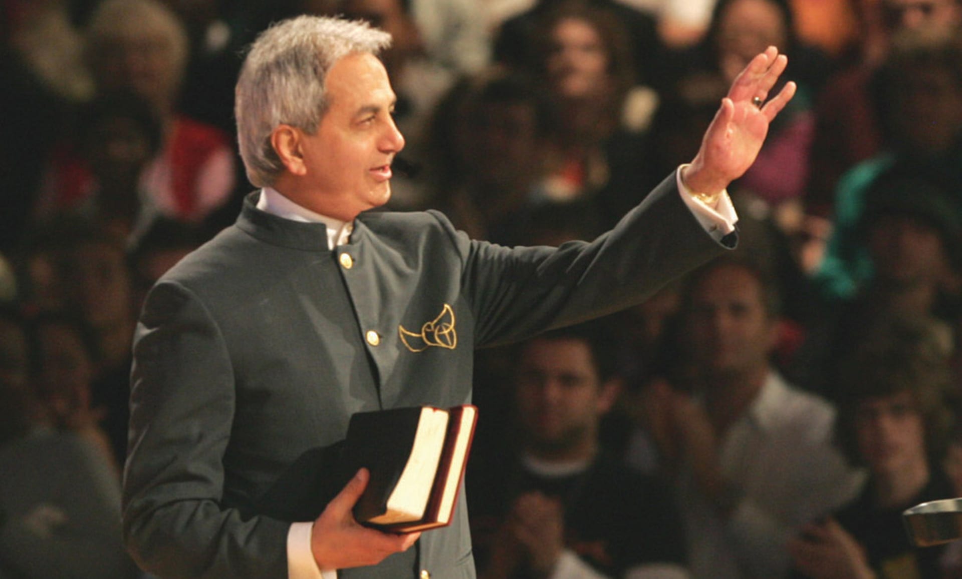 Benny Hinn holding Bible