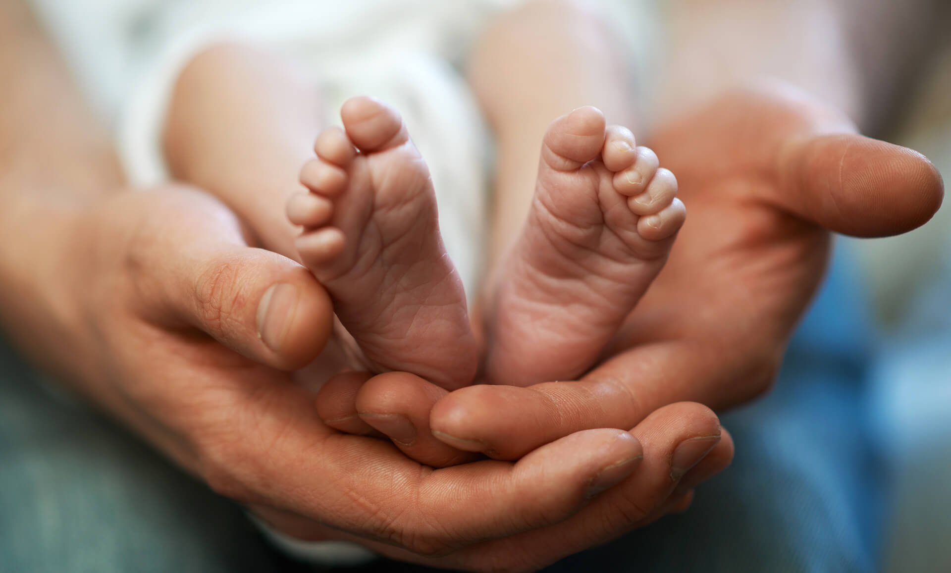 holding baby feet - enewsletter - Benny Hinn Ministries