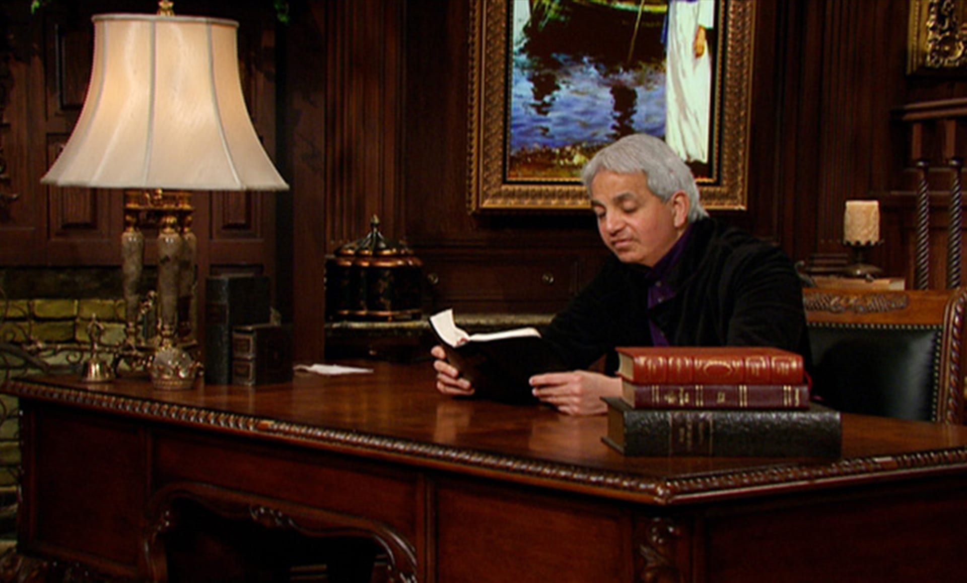 Benny Hinn at desk