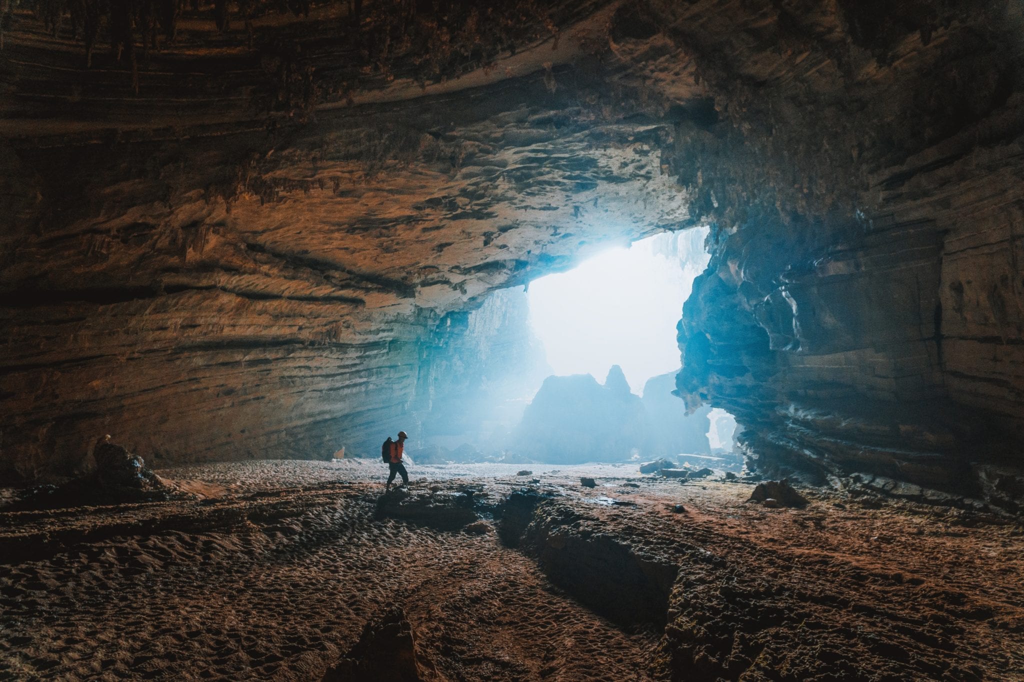 Walking towards light in cave