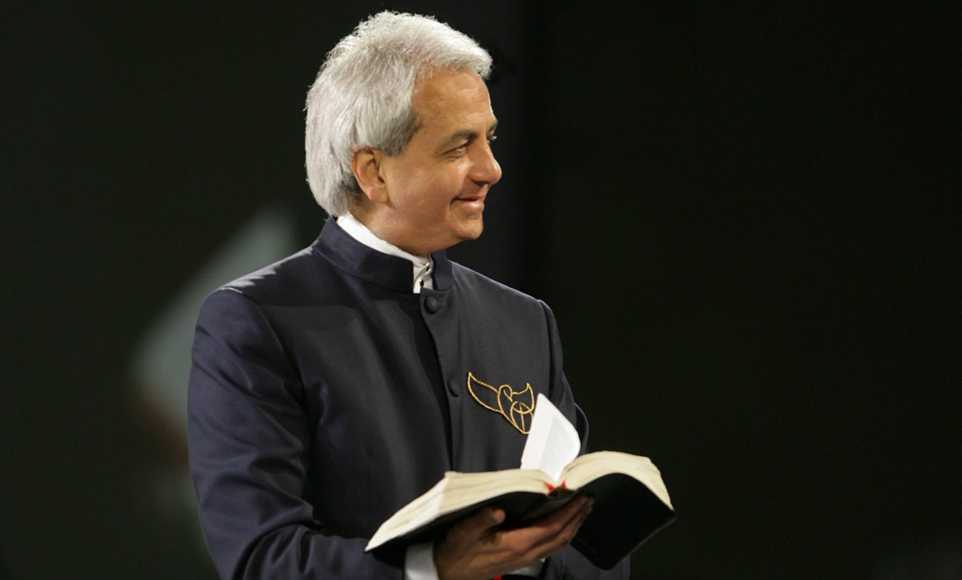 Benny Hinn smiling with Bible