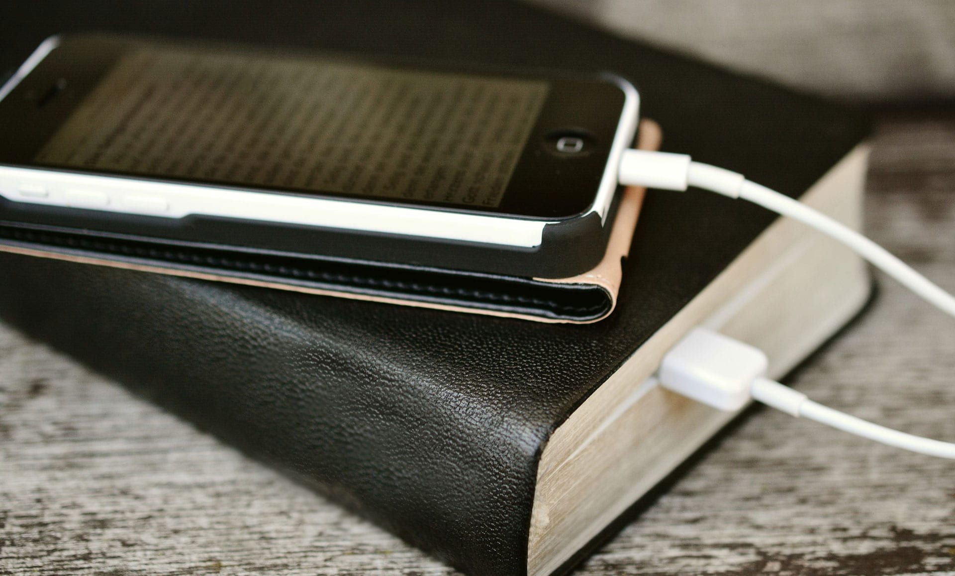 Cell phone plugged into bible