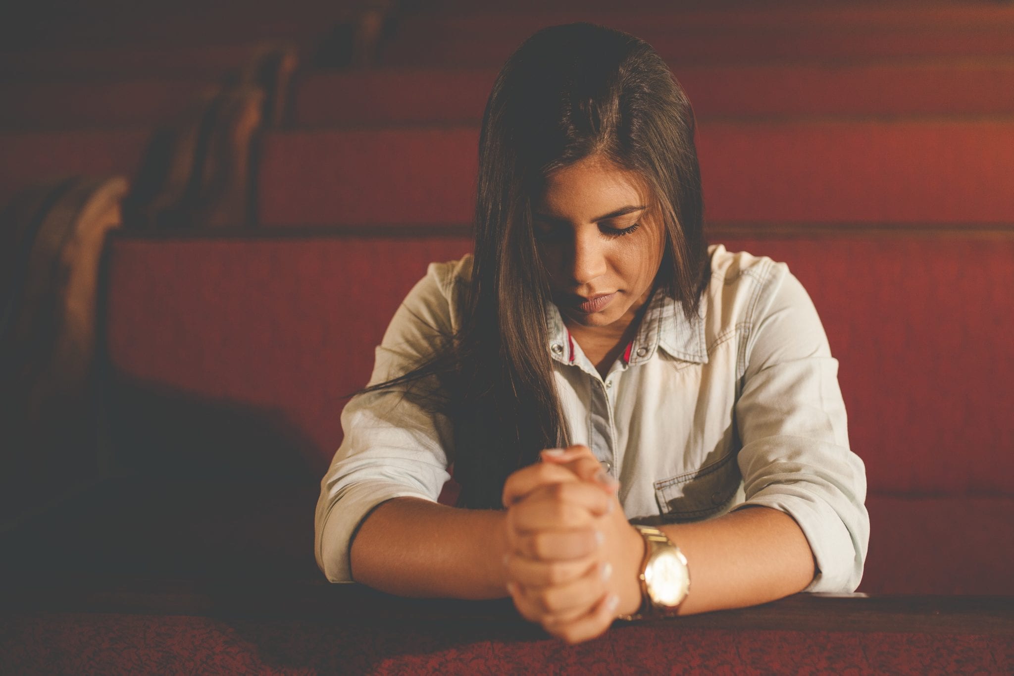 women praying in church