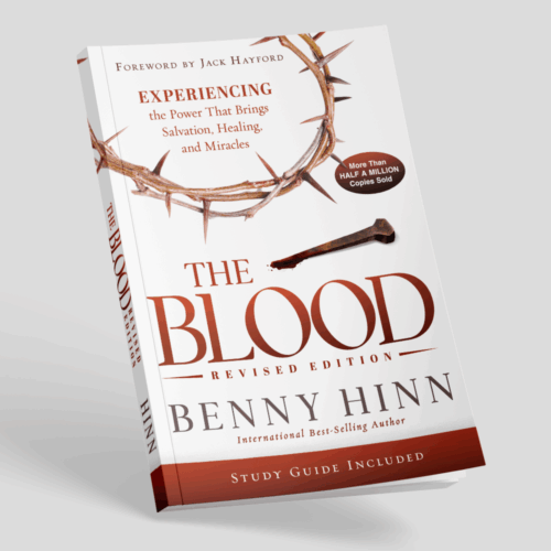 The Blood book by Benny Hinn on grey background